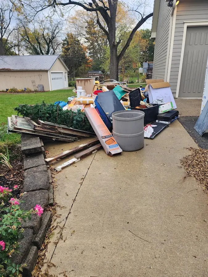 Dumpster being loaded with debris for Residential Dumpster Rental in Chesterfield
